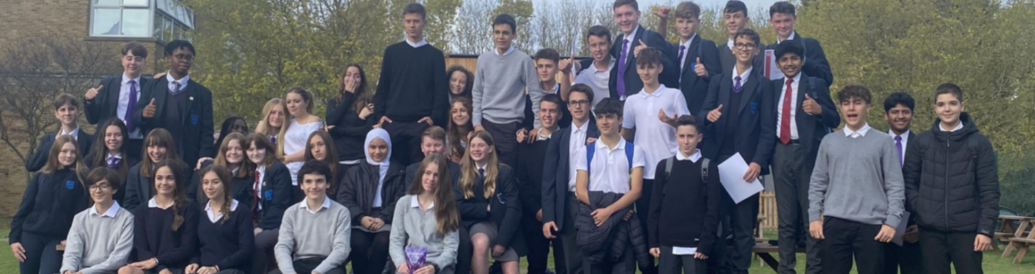 A group of students and their Spanish 'buddies' smiling for a photo