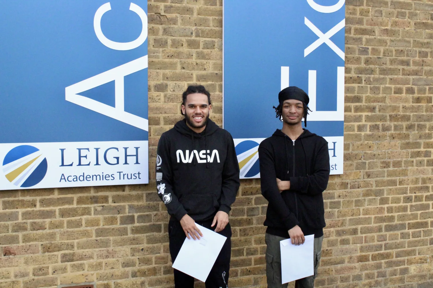 Students holding their results