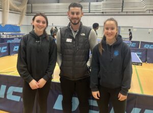 A photo of 3 people smiling at the Table Tennis Regional Finals